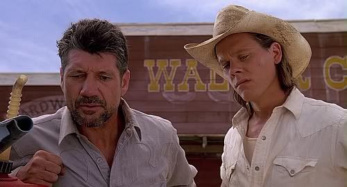 Kevin Bacon and Fred Ward star as two friends with a couple of odd jobs